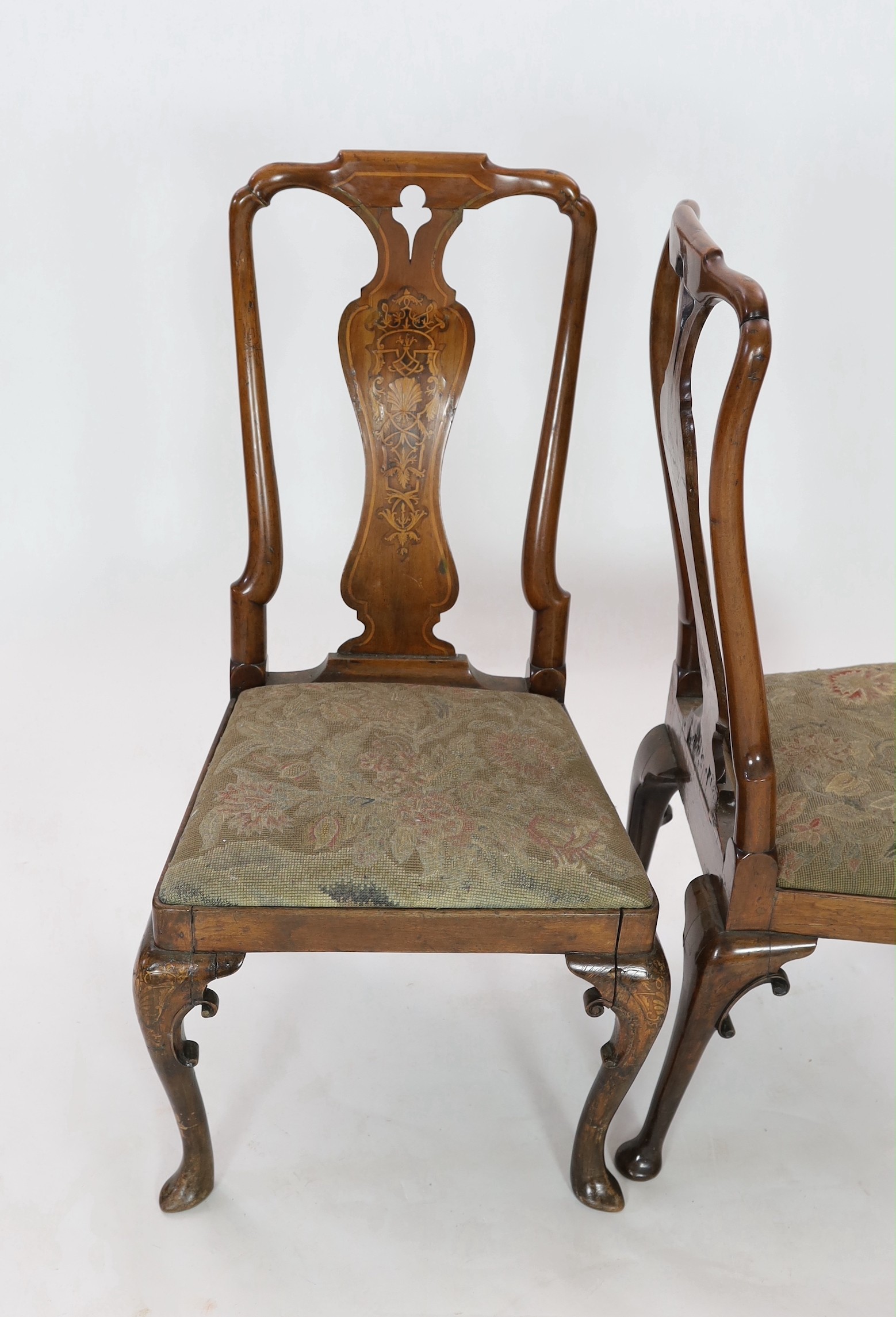 A pair of George I walnut and marquetry side chairs, c.1720, Restorations